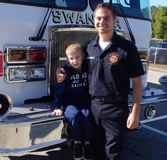 Volunteer Firefighter-EMT with nephew Logan